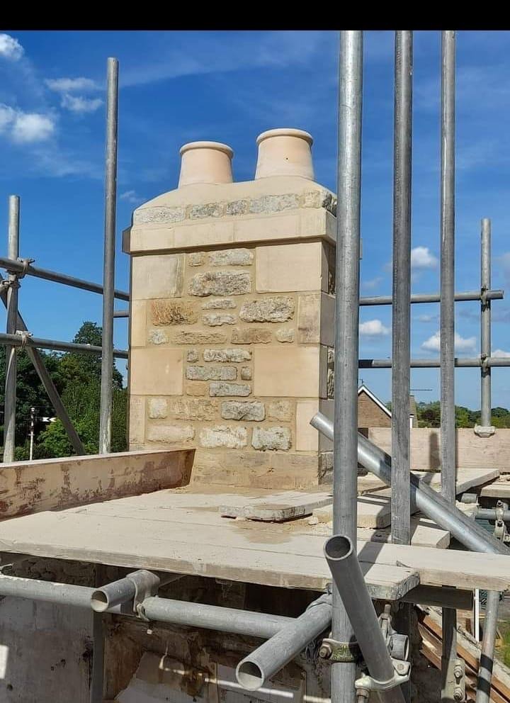 Stone chimney with twin pots and lead flashing