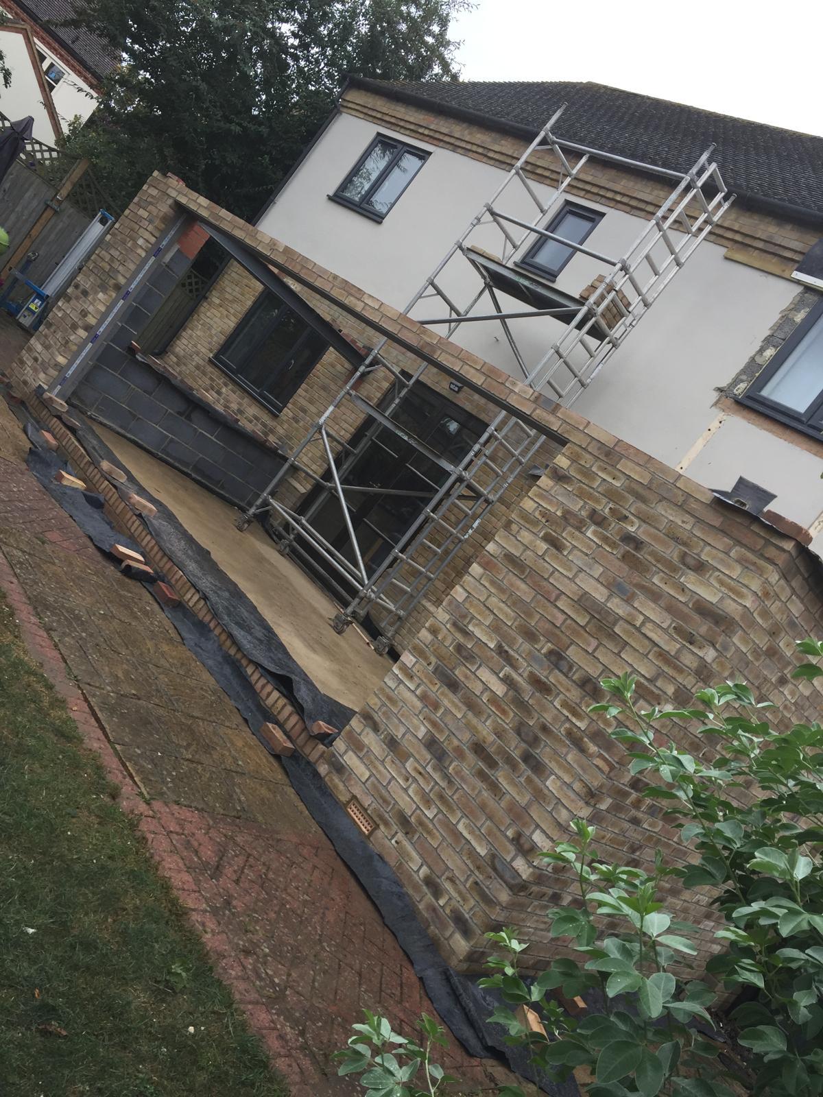 Scaffold around brick extension by Advanced Scaffolding